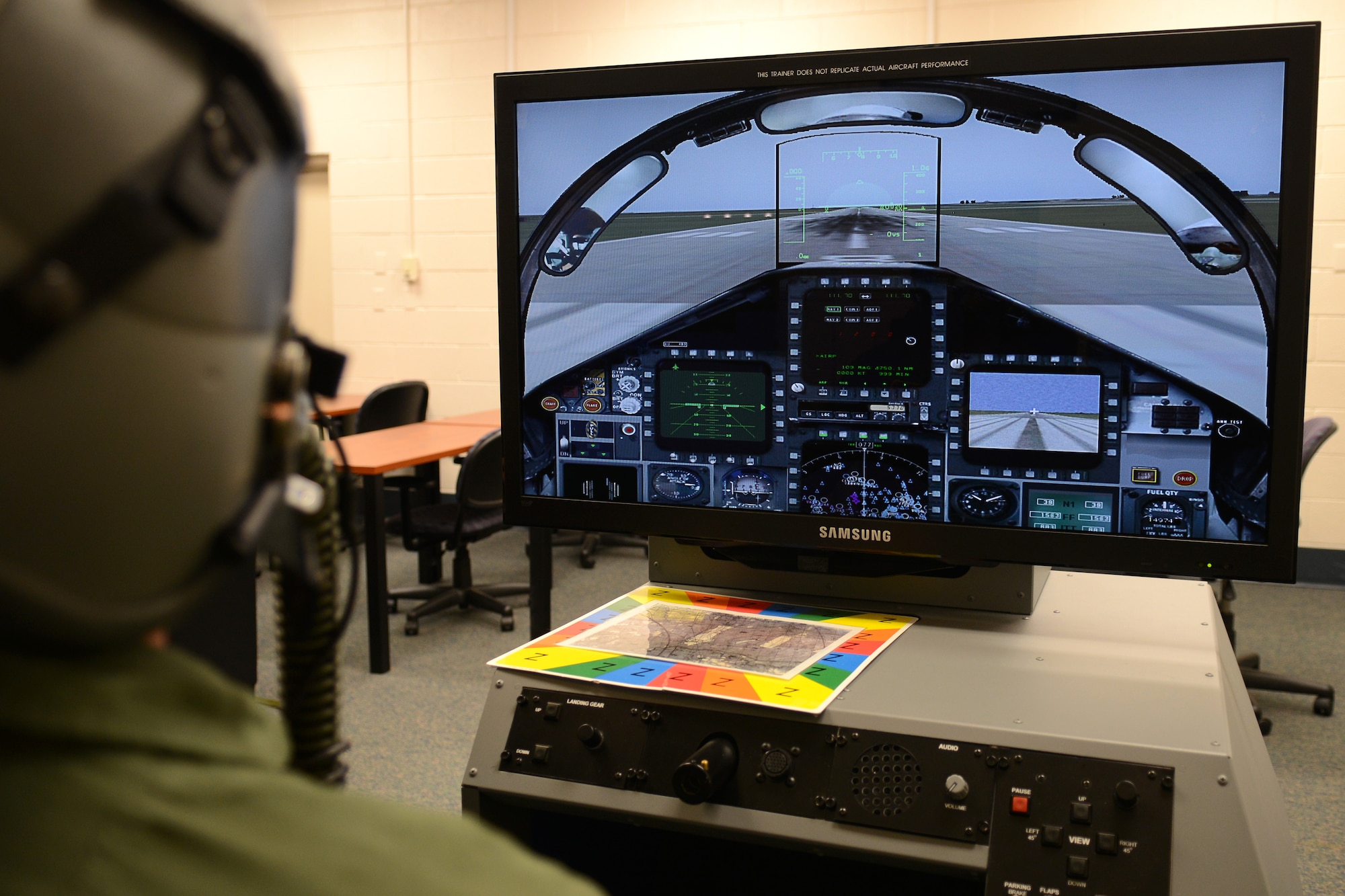 U.S. Air Force Senior Airman Mason Wyman, 633rd Aerospace Medical Squadron physiology technician, tests a new Reduced Oxygen Breathing Device at Langley Air Force Base, Va., Dec. 11, 2014. Unlike the hypobaric chamber, the ROBD simulates flights on a digital screen, which a pilot would operate while experiencing hypoxia. (U.S. Air Force photo by Airman 1st Class Devin Scott Michaels/Released)