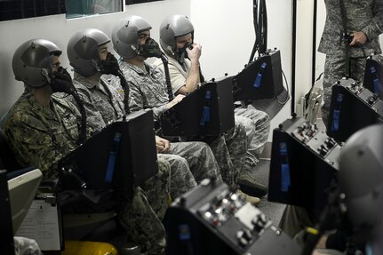 U.S. Service members train to recognize and mitigate symptoms of hypoxia in the hypobaric chamber at Langley Air Force Base, Va., Dec. 11, 2014. The hypobaric chamber changes air pressure and chemistry to simulate different heights in altitude to train pilots and aircrew members to handle the physiological stresses of fights. (U.S. Air Force photo by Airman 1st Class Devin Scott Michaels/Released)