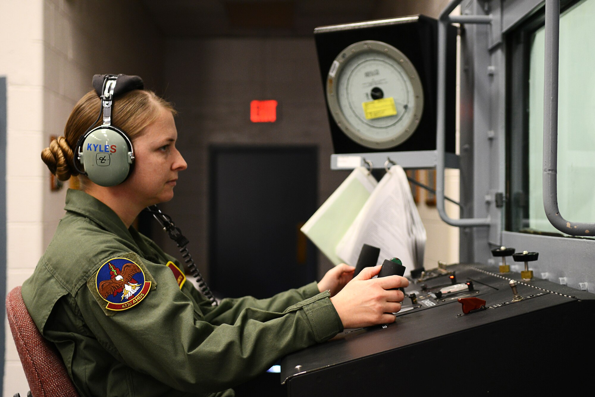 U.S. Air Force Tech. Sgt. Isis Lovette, 633rd Aerospace Medical Squadron operations noncommissioned officer in charge, operates the hypobaric chamber for the last time at Langley Air Force Base, Va., Dec. 11, 2014. The 633rd AMS is set to begin using the more cost-efficient Reduced Oxygen Breathing Device. (U.S. Air Force photo by Airman 1st Class Devin Scott Michaels/Released)