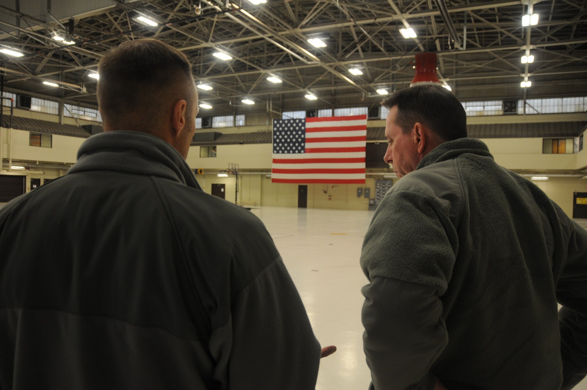 Maj. Gen. John Shanahan, commander of the 25th Air Force, speaks with Lt. Col. Robert Kinney, commander of the 188th Intelligence, Surveillance and Reconnaissance Group, at Ebbing Air National Guard Base, Fort Smith, Ark., Dec. 11, 2014. Shanahan’s visit encompassed seeing and understanding how the wing’s new mission aligns with the 25th AF. (U.S. Air National Guard photo by Airman 1st Class Cody Martin/released)
