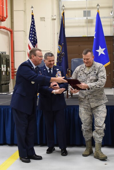 Maj. Gen. John Murphy, assistant adjutant general – air, Pennsylvania National Guard, left, presents the Air National Guard Region IV Fiscal Year 2014 Second Quarter Award with Top Health Professional Accessions to Col. Christopher Dutton, 193rd Special Operations Mission Support Group commander. Dutton accepted the award on behalf of the 193rd Special Operations Wing recruiting team during the 193rd SOW annual award ceremony, Dec. 7, 2014, Middletown, Pennsylvania. (U.S. Air National Guard photo by Airman Julia Sorber/Released)