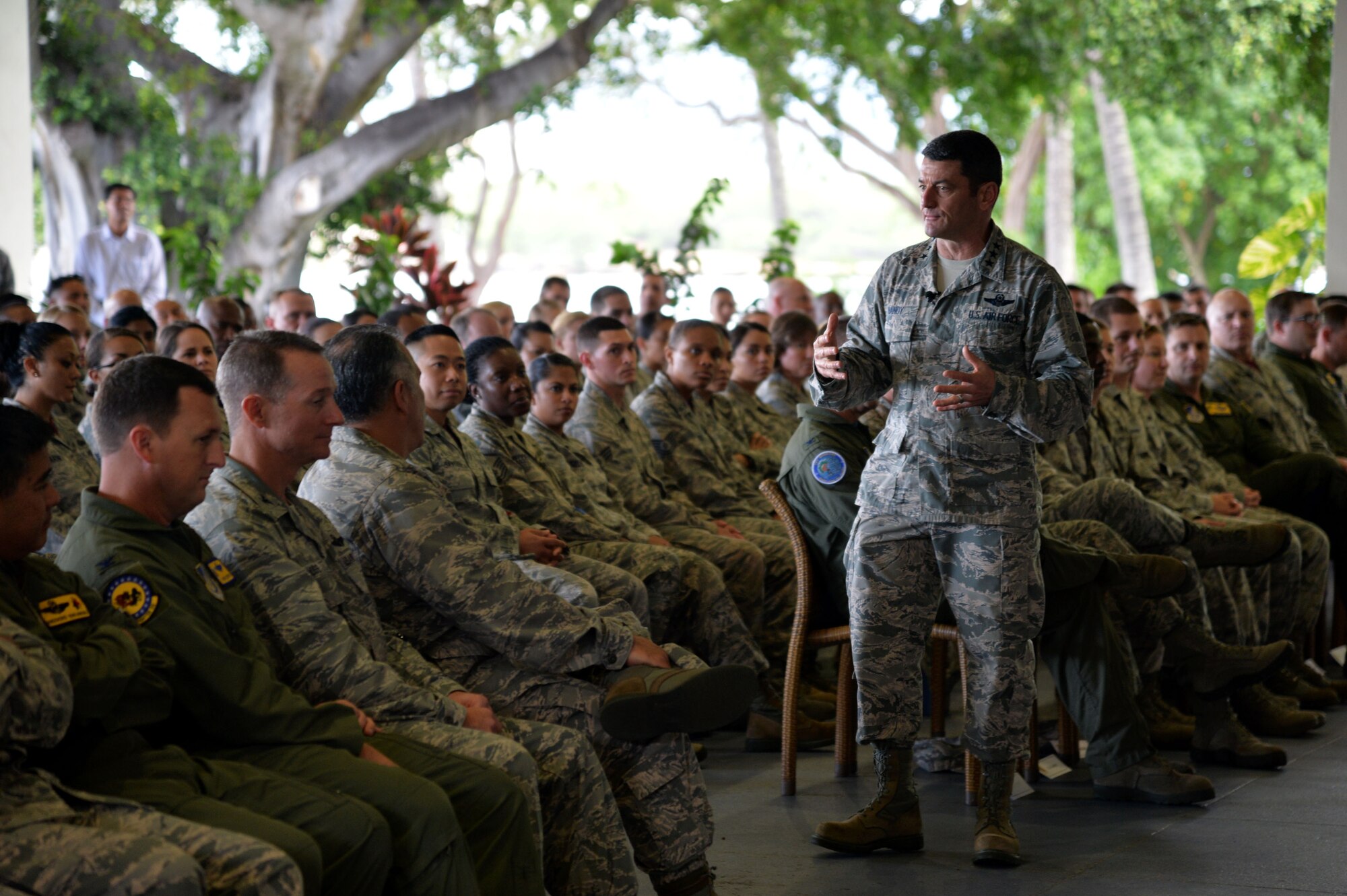 Lt. Gen. Russell Handy, 11th Air Force commander, speaks with 15th Wing Airmen during an all-call at Joint Base Pearl Harbor-Hickam, Hawaii, Dec. 12, 2014. Handy thanked the audience for their hard work, and addressed Air Force and Pacific-region topics of interest. In addition to the all-call, Handy met with group and squadron leadership and toured base units. (U.S. Air Force photo by Staff Sgt. Alexander Martinez/Released)      