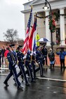 The 4th Fighter Wing Honor Guard marches in the annual holiday parade in Goldsboro, North Carolina, Dec. 6, 2014. Along with the honor guard, a fire truck and Airmen from the 4th Civil Engineer Squadron fire department, a vehicle and Airmen from the 4th CES Explosive Ordnance Disposal flight, and Col. Mark Slocum, 4th Fighter Wing commander, participated in the parade. (U.S. Air Force photo/Airman Shawna L. Keyes)