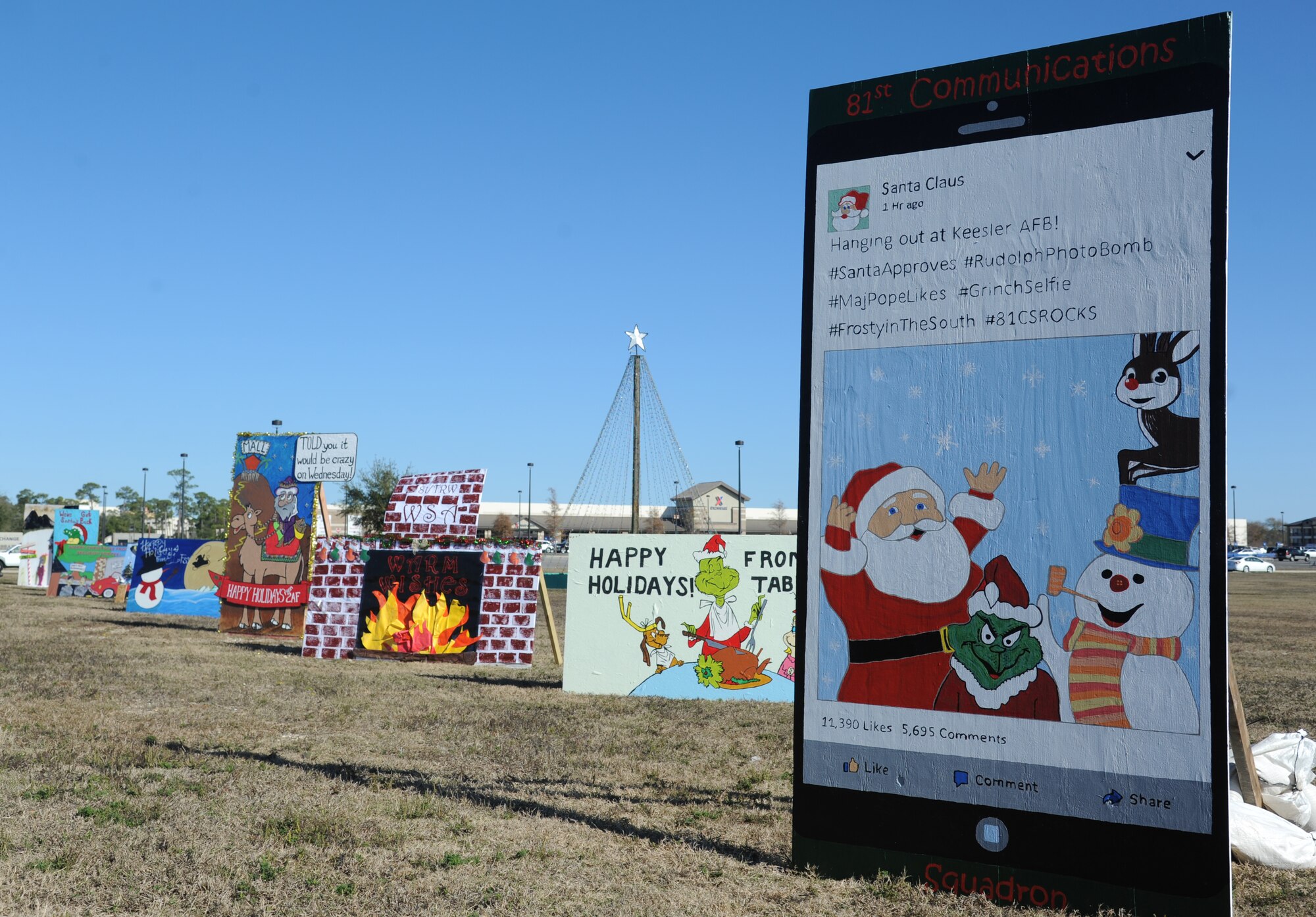 Oversized handcrafted holiday cards created for the Squadron Holiday Card Contest sit on display along Larcher Blvd. in front of the base exchange Dec. 16, 2014, at Keesler Air Force Base, Miss.  The contest, sponsored by the 81st Force Support Squadron, will be judged Dec. 18 in the following categories: most charismatic, innovative and classic. (U.S. Air Force photo by Kemberly Groue)