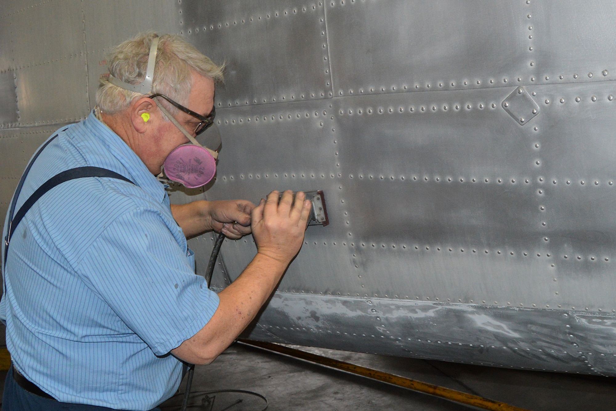 DAYTON, Ohio -- Restoration specialist Randy Canady works on the Fairchild C-119J Flying Boxcar in the restoration hangar at the National Museum of the United States Air Force. (U.S. Air Force photo)
