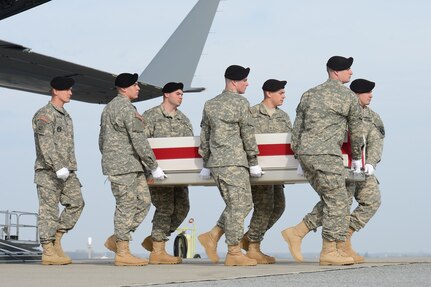 A U.S. Army carry team transfers the remains of Spc. Wyatt J. Martin, of Mesa, Ariz., during a dignified transfer Dec. 16, 2014, at Dover Air Force Base, Del. Martin was assigned to 2nd Squadron, 3rd Cavalry Regiment, 1st Cavalry  Division, Fort Hood, Texas. (U.S. Air Force photo/Greg L. Davis)