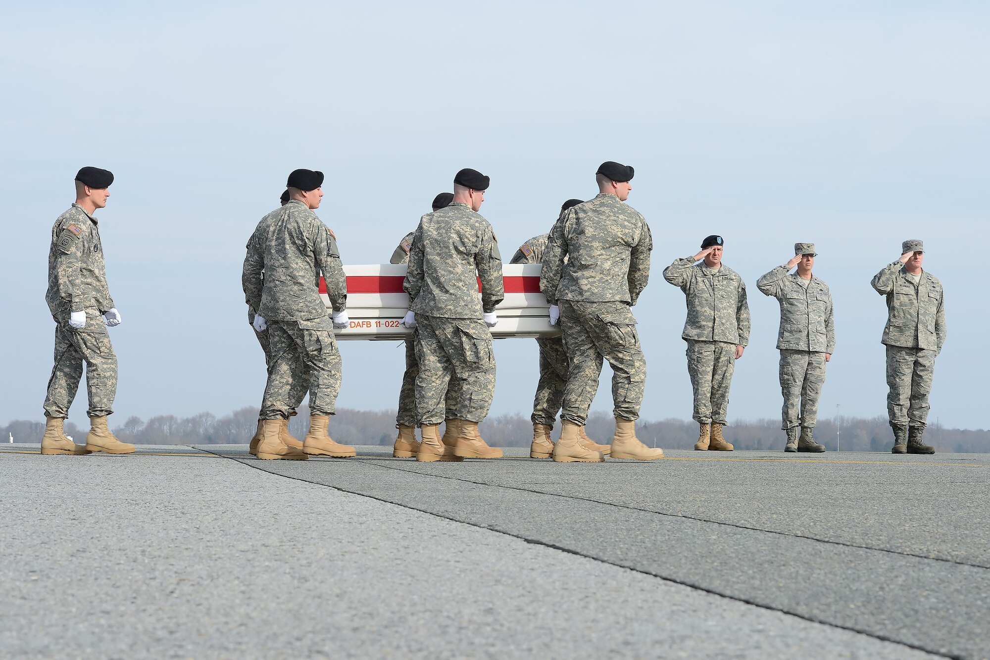 A U.S. Army carry team transfers the remains of Sgt. 1st Class Ramon S. Morris, of New York, N.Y., during a dignified transfer Dec. 16, 2014, at Dover Air Force Base, Del. Morris was assigned to 2nd Squadron, 3rd Cavalry Regiment, 1st Cavalry  Division, Fort Hood, Texas. (U.S. Air Force photo/Greg L. Davis)
