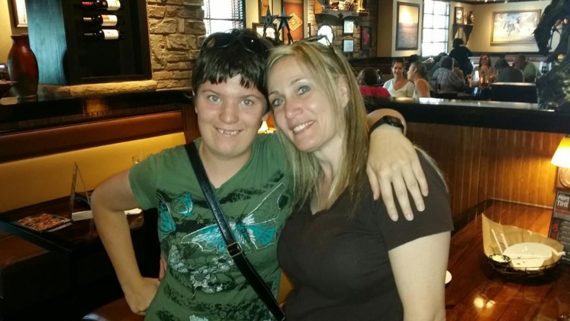 Airman Emily Tobias, 366th Comptroller Squadron customer service technician, poses with her aunt Deann Hartley at a Cracker Barrel in Aiken, S.C., August 2014. Spending the holidays without relatives will be a first for Tobias this year. (Courtesy photo)