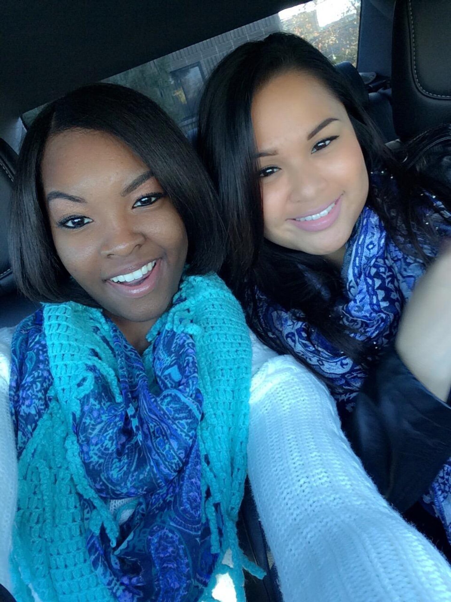 Airman 1st Class Kayla Stennis, 366th Operations Support Squadron aircrew flight equipment technician, takes a selfie with Airman Regina Dayrit, 726th Air Control Squadron surveillance technician, in Idaho, Nov. 2014. Stennis considers Dayrit to be part of her military family and enjoys spending time with her outside of the duty day. (Courtesy photo)