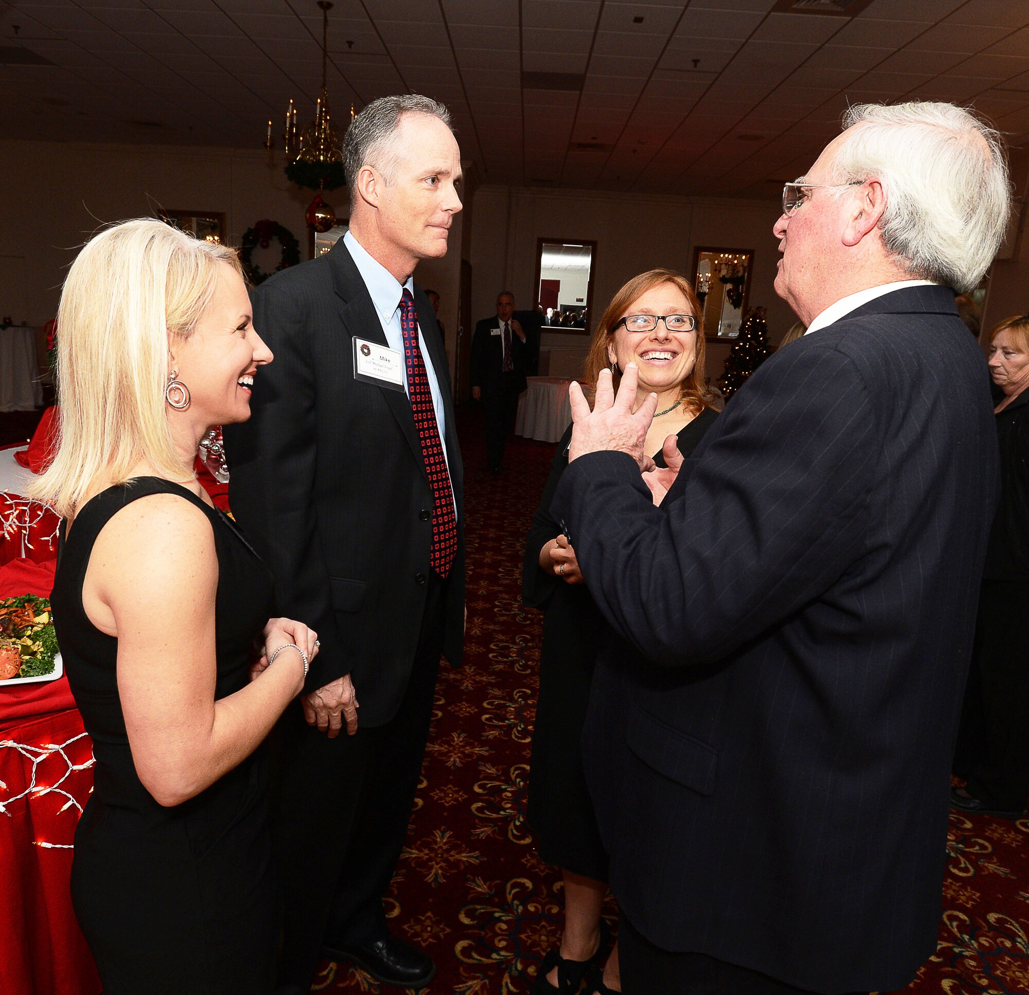 Col. Michael A. Vogel and his wife, Misty, talk to Bedford Selectmen Margot Fleishman and William Moonan at a holiday reception held at the Minuteman Commons on Hanscom Air Force Base Dec. 13.  The Installation Holiday Reception welcomed military, community and state leadership to celebrate the holiday season.  (U.S. Air Force photo by Jerry Saslav)