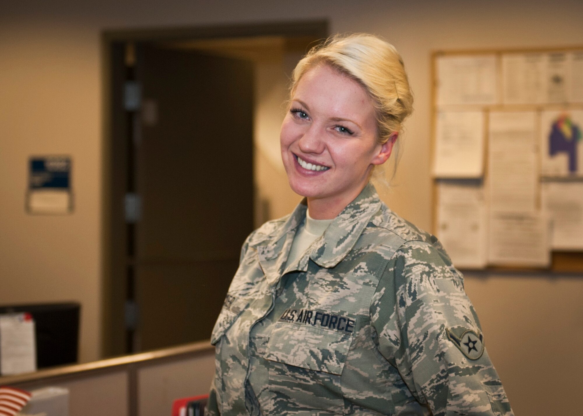 PETERSON AIR FORCE BASE, Colo. – Airman Ashley Zwicker, 21st Force Support Squadron Military Personnel Section customer service apprentice, poses for a photo while taking a break from her busy day at the MPS office, Dec. 8, 2014. Zwicker spends her day approving leave, updating Airmen personal information on Defense Enrollment Eligibility Reporting System, giving newcomer briefings and making ID cards. (U.S. Air Force photo by Airman 1st Class Rose Gudex)