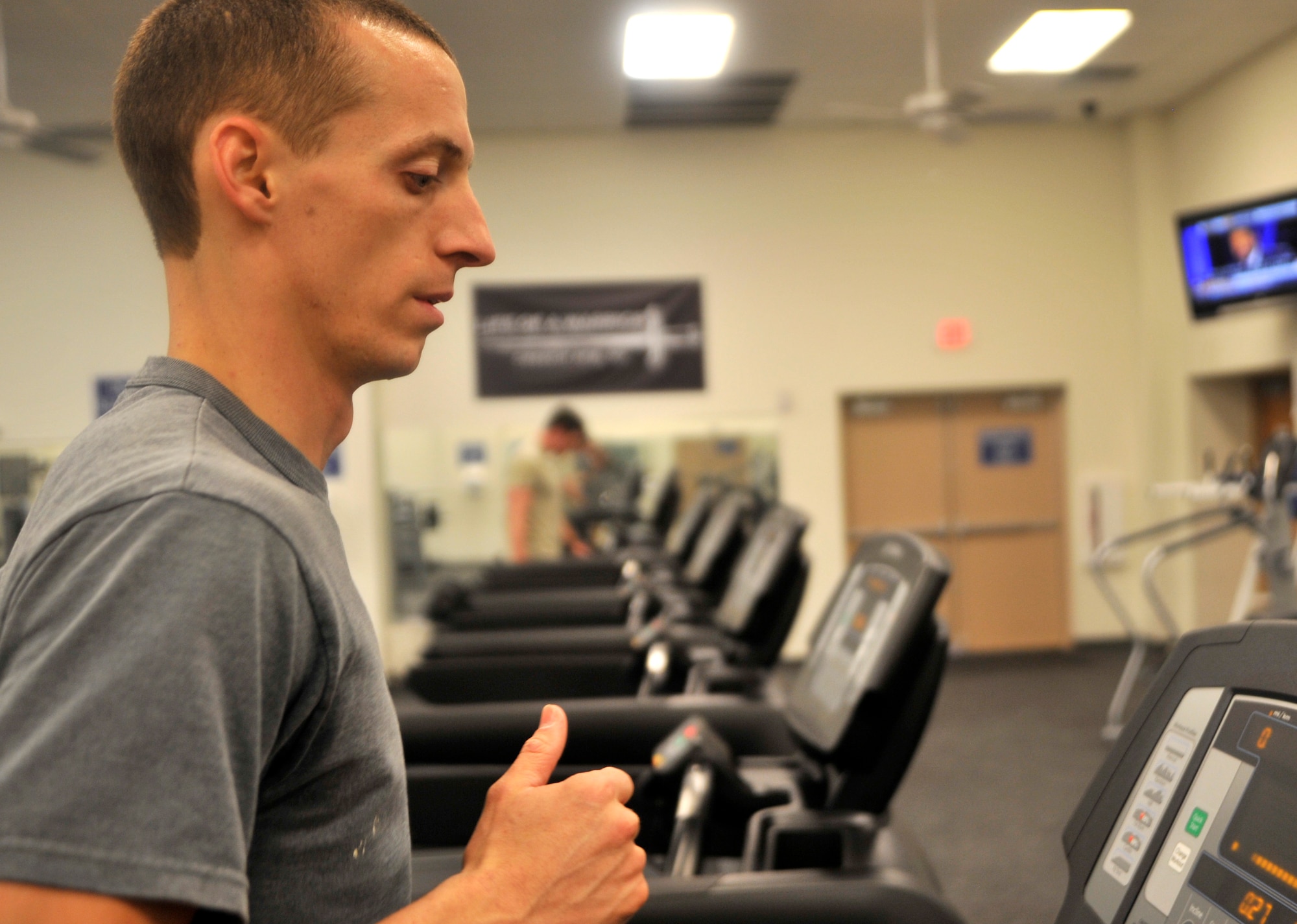 2nd Lt. Joel, 11th Reconnaissance Squadron intelligence instructor, runs on a new treadmill in the Predator Fitness Center Dec. 11, 2014, at Creech Air Force Base, Nevada. The 799th Air Base Group renovated the facility and replaced all the cardio equipment Dec. 4-5, 2014, providing better services and workout capabilities for Creech Airmen. (U.S. Air Force photo by Airman 1st Class Christian Clausen/Released)(Last names withheld for security purposes)
