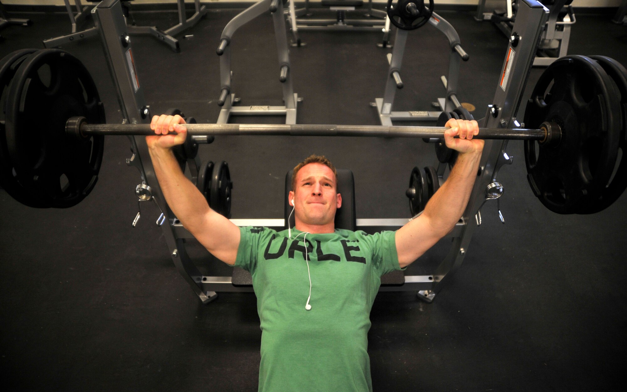 Airman 1st Class Einar, 18th Reconnaissance Squadron sensor operator, performs incline bench presses at the Predator Fitness Center Dec. 11, 2014, at Creech Air Force Base, Nevada. The fitness center underwent $172,000 worth of renovations Dec. 4-5, 2014, including new cardio and strength equipment and new flooring. (U.S. Air Force photo by Airman 1st Class Christian Clausen/Released)(Last names withheld for security purposes)