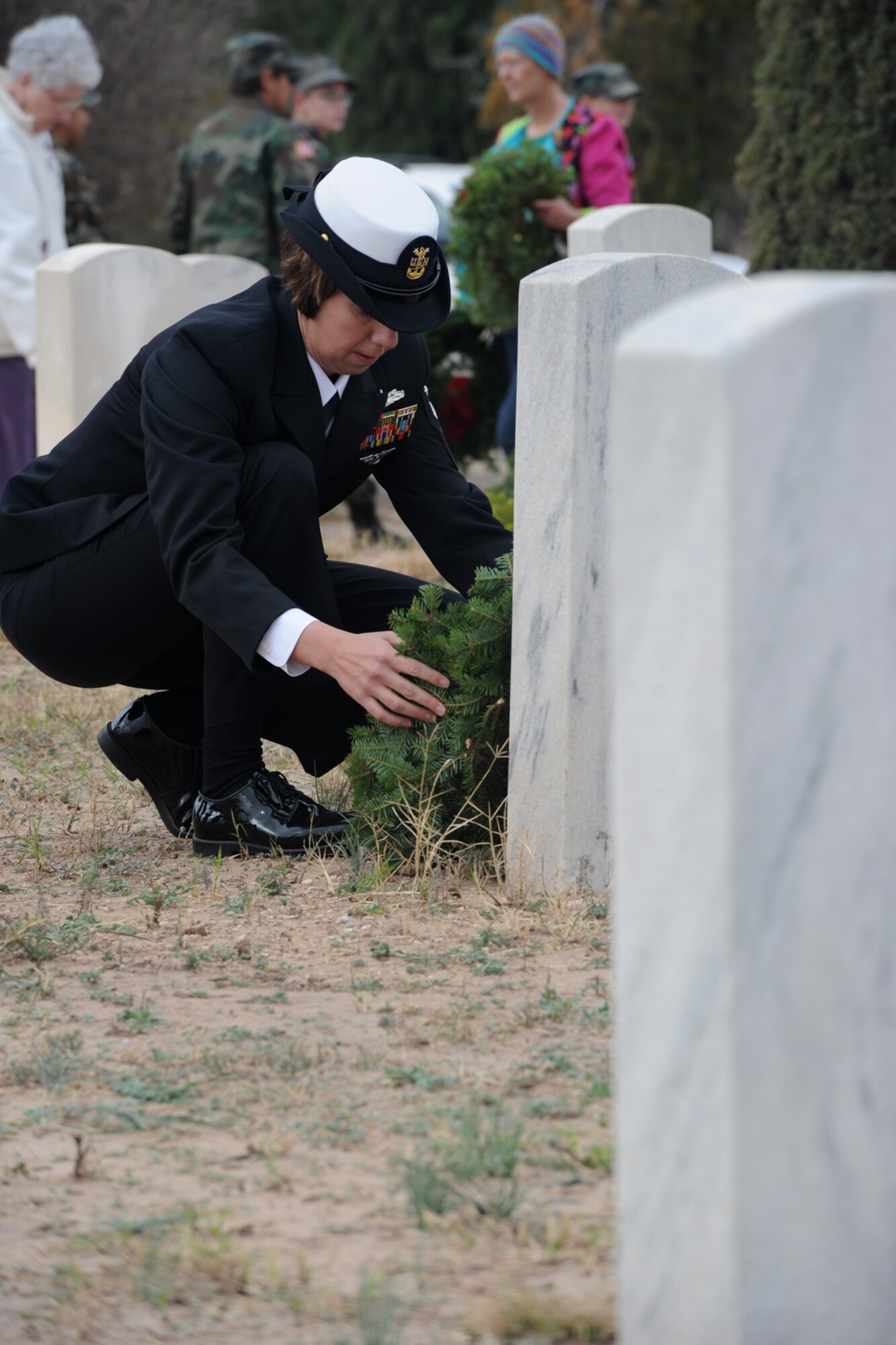 SAN ANGELO, Texas – Master Chief Petty Officer Michelle L. O’Grady, Goodfellow Air Force Base Navy Center for Information Dominance Detachment senior enlisted advisor, places a wreath during the Wreaths Across America event at Belvedere Cemetery Dec. 13. Wreaths Across America’s mission is Remember, Honor, Teach; remember the fallen, honor those who serve and teach our children the value of freedom. (U.S. Air Force photo/ Staff Sgt. Laura R. McFarlane)