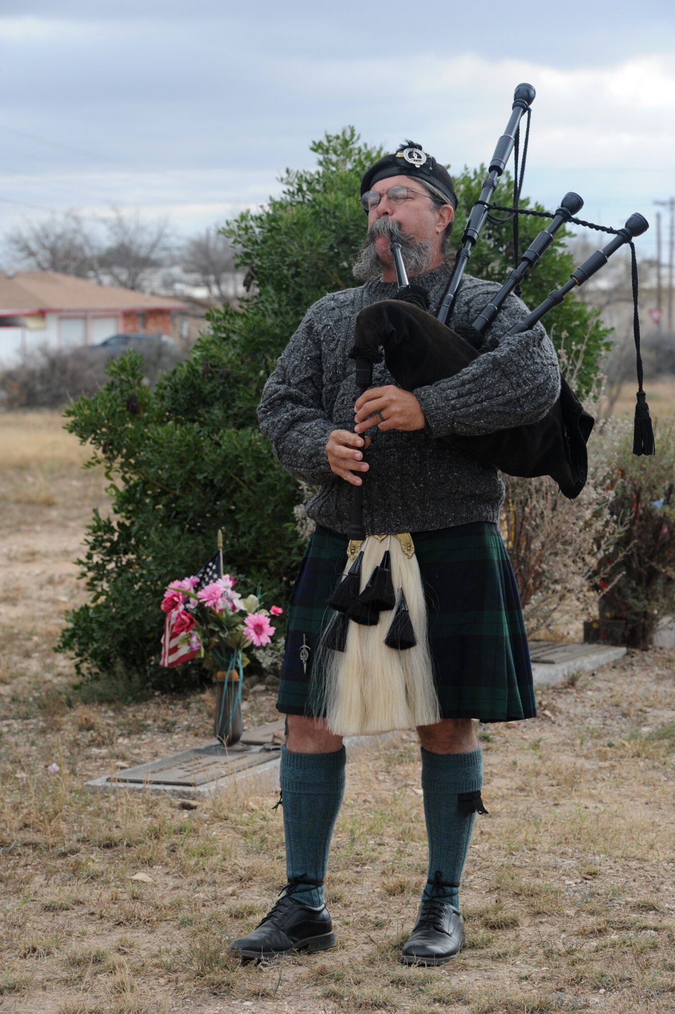 SAN ANGELO, Texas – Chris Morgan, Fort Concho re-enactor, plays the bagpipes during the Wreaths Across America event at Belvedere Cemetery Dec. 13. The tradition of the wreath laying ceremony began at Arlington National Cemetery in 1992 and has grown to more than 600 locations across the nation. (U.S. Air Force photo/ Staff Sgt. Laura R. McFarlane)