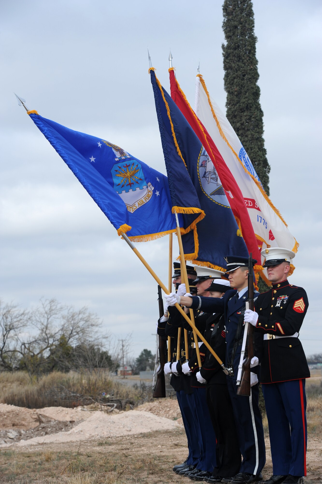 SAN ANGELO, Texas – The Goodfellow Air Force Base Joint Service Color Guard present the Air Force flag as the Air Force wreath is laid during the Wreaths Across America event at Belvedere Cemetery Dec. 13. The San Angelo Composite Squadron Civil Air Patrol hosted this event honoring deceased service members and their families. (U.S. Air Force photo/ Staff Sgt. Laura R. McFarlane)