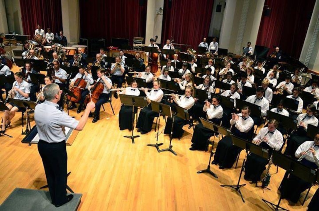 The Concert Band hosted the Eltham High School Symphonic Band from Melbourne, Australia for a morning of rehearsal and a joint performance.  The students are on a US Tour and enjoyed playing beside and learning from the members of the Concert Band.  Colonel Lang gave a clinic and concluded the morning with a mass performance of The Star and Stripes Forever. (US Air Force Photo by Senior Master Sgt Bob Kamholz/released)