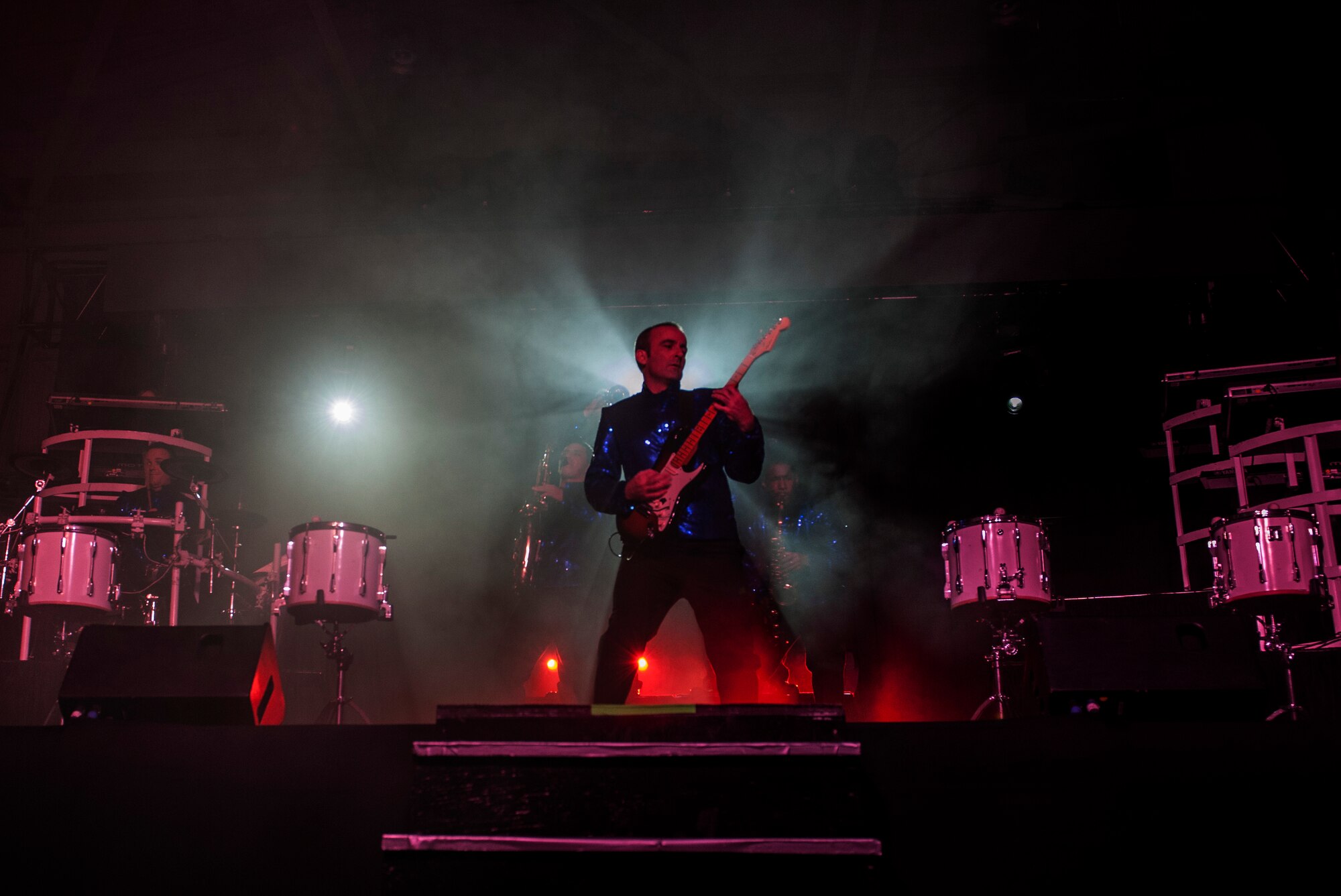 Master Sgt. Justin Worley, 744th Communications Squadron cyber transport craftsman, plays guitar during a Tops In Blue show Dec. 13, 2014, Incirlik Air Base, Turkey. For 60 years Tops In Blue has been entertaining Airmen, families and audiences around the world. (U.S. Air Force photo by Senior Airman Krystal Ardrey/Released)