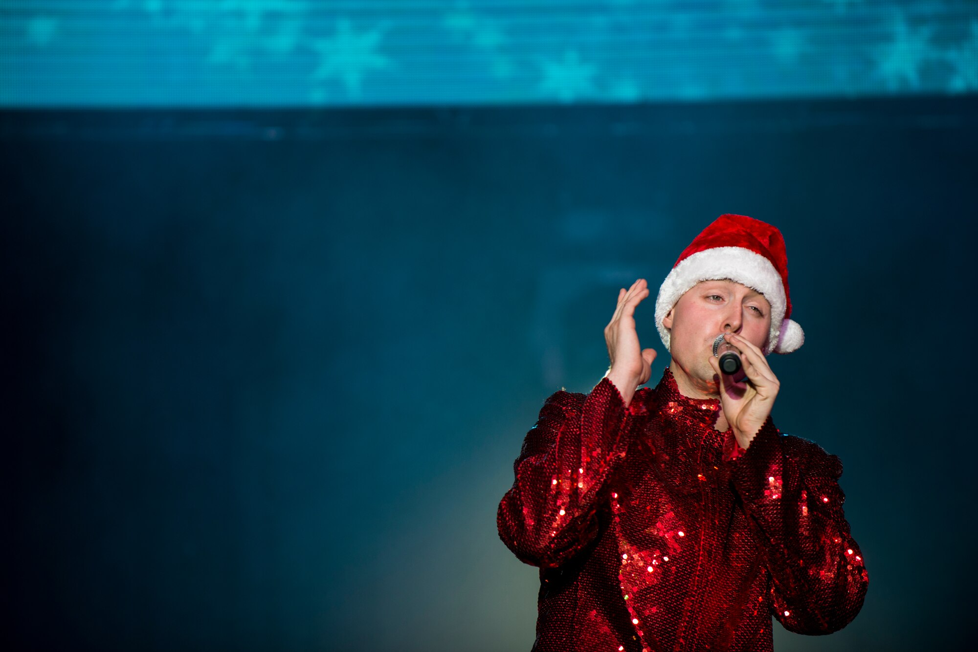 Airman 1st Class Alexander Ross, 673rd Logistics Readiness Squadron fuels apprentice, performs during a Tops In Blues show Dec. 13, 2014, at Incirlik Air Base, Turkey. Current tours average nine months and perform for audiences reaching up to 350,000 people in over 20 countries. (U.S. Air Force photo by Airman Cory W. Bush/Released)