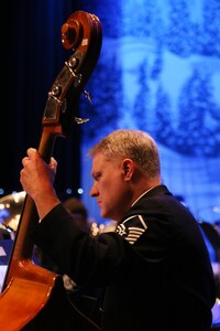 Master Sgt. Douglas Bennett, U.S. Air Force Band of the West Concert Band bass player, performs holiday classics during the Holiday in Blue Concert Dec. 6 at the Edgewood Theatre of Performing Arts in San Antonio, Texas. The Band of the West is composed of a 60-member squadron comprised of nine different musical configurations. The band executes more than 300 annual musical productions and is responsible for a seven state, 580,000 square mile region. (U.S. Air Force photo by Airman 1st Class Alexandria Slade)