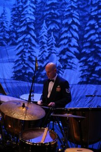 Tech. Sgt. Charles Lawyer, U.S. Air Force Band of the West Concert Band percussionist, plays the drums during the annual Holiday in Blue Concert Dec. 6 at the Edgewood Theatre of Performing Arts in San Antonio, Texas. The Band of the West is composed of a 60-member squadron comprised of nine different musical configurations. The band executes more than 300 annual musical productions and is responsible for a seven state, 580,000 square mile region. (U.S. Air Force photo by Airman 1st Class Alexandria Slade)