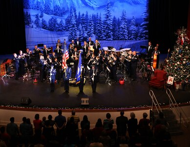 The Joint Base San Antonio Honor Guard presents the colors during the annual Holiday in Blue Concert performed by the U.S. Air Force Band of the West Concert Band Dec. 6 at the Edgewood Theatre of Performing Arts in San Antonio, Texas. The Band of the West is composed of a 60-member squadron comprised of nine different musical configurations. The band executes more than 300 annual musical productions and is responsible for a seven state, 580,000 square mile region. (U.S. Air Force photo by Airman 1st Class Alexandria Slade)