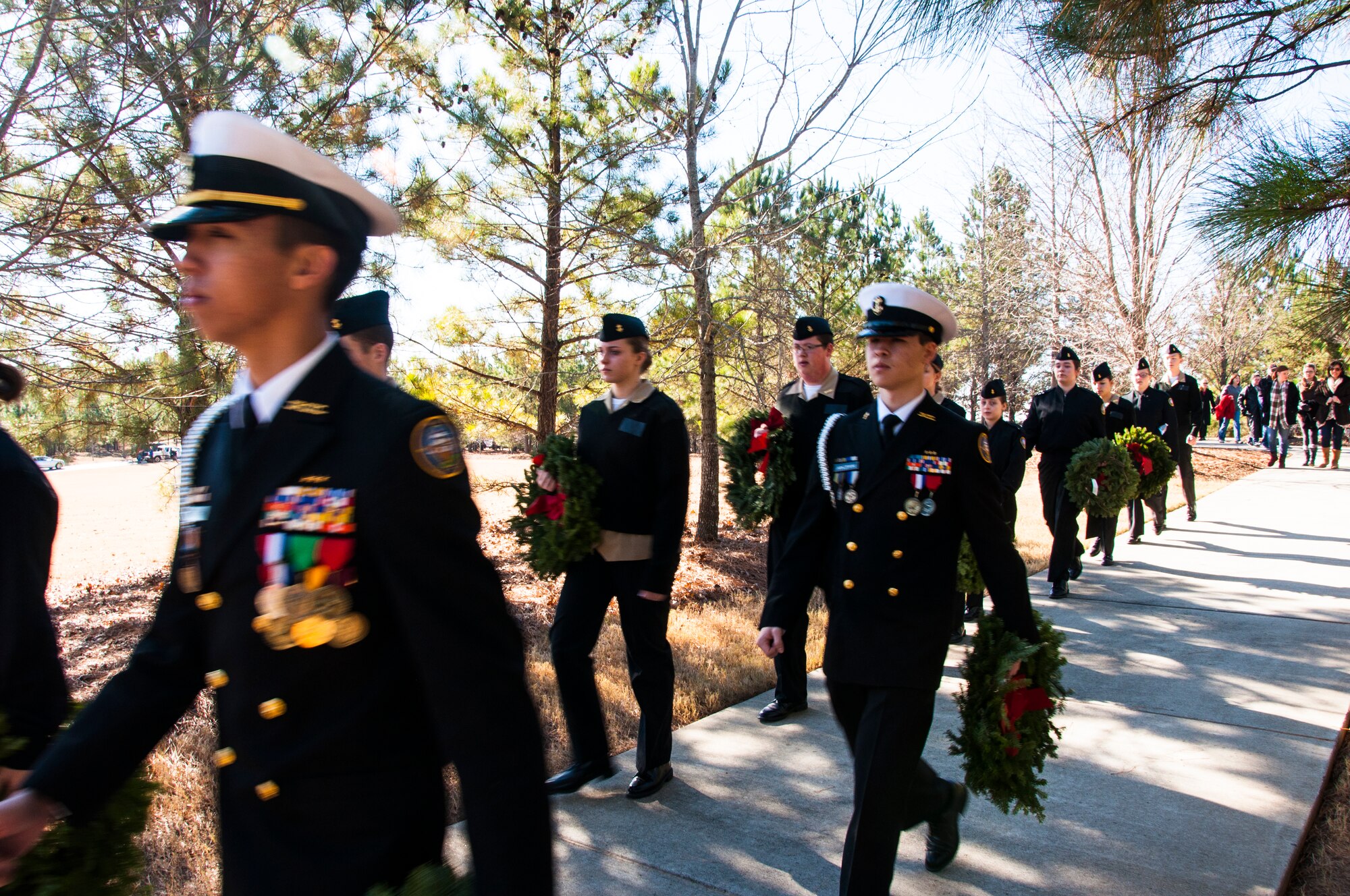Junior Reserve Officer Training Corps members march in formation for the Wreaths Across America ceremony at Georgia National Cemetery in Canton, Ga. Dec. 13, 2014. Wreaths Across America occurs the second Saturday of December every year. (U.S. Air Force photo/Senior Airman Daniel Phelps)