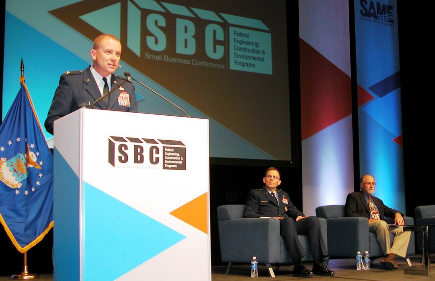Col. Brian Duffy, Air Force Installation and Mission Support Center (Provisional) vice commander, presents information about his unit to an audience of more than 750 industry representatives at the Air Force general session that kicked off service briefings at the 2014 Society of American Military Engineers Small Business Conference Dec. 9 in Kansas City. (U.S. Air Force photo/Michael Briggs/released)
