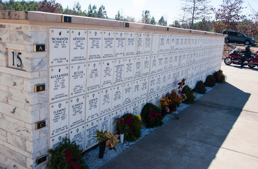 Wreaths lay on gravestones after the Wreaths Across America ceremony at Georgia National Cemetery in Canton, Ga. Dec. 13, 2014. Wreaths Across America occurs the second Saturday of December every year. (U.S. Air Force photo/Senior Airman Daniel Phelps)