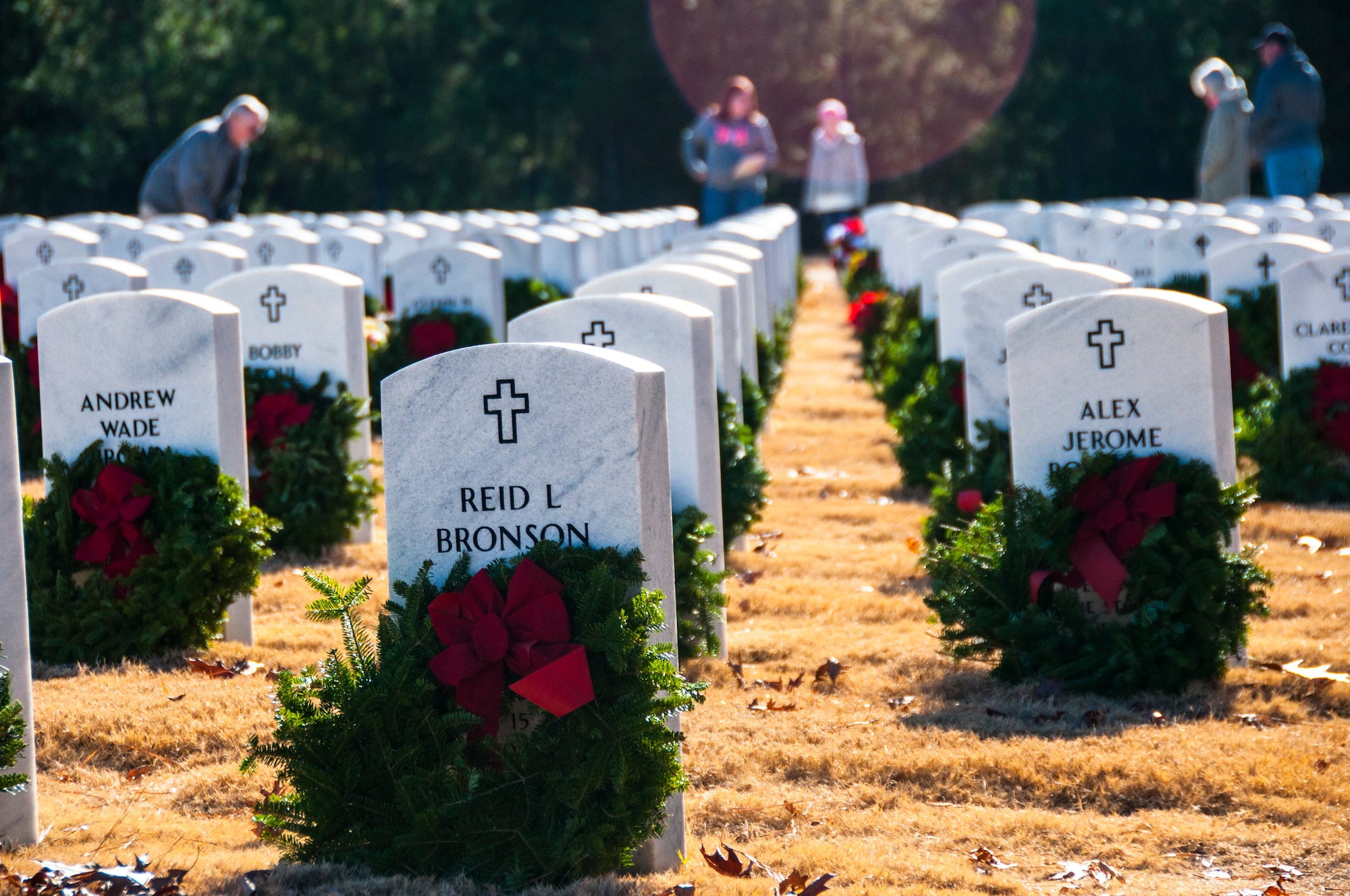 Wreaths lay on gravestones after the Wreaths Across America ceremony at Georgia National Cemetery in Canton, Ga. Dec. 13, 2014. Wreaths Across America occurs the second Saturday of December every year. (U.S. Air Force photo/Senior Airman Daniel Phelps)