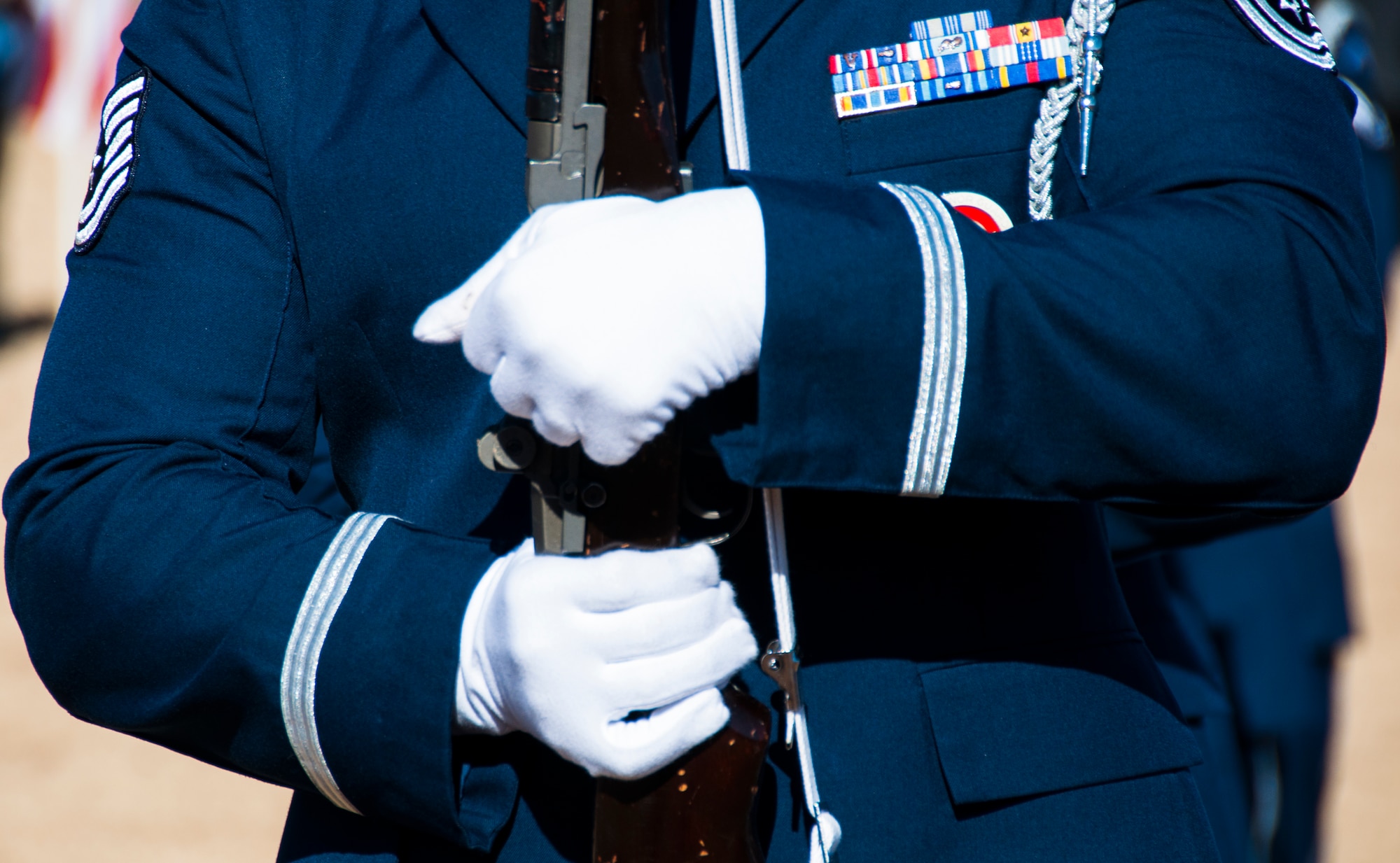 An Honor Guard member from Dobbins Air Reserve Base, Ga. charges his weapon for Wreaths Across America ceremony at Georgia National Cemetery in Canton, Ga. Dec. 13, 2014. The vision of the U.S. Air Force Honor Guard is to ensure a legacy of Airmen who promote the mission, protect the standards, perfect the image and preserve the heritage of the organization. (U.S. Air Force photo/Senior Airman Daniel Phelps)