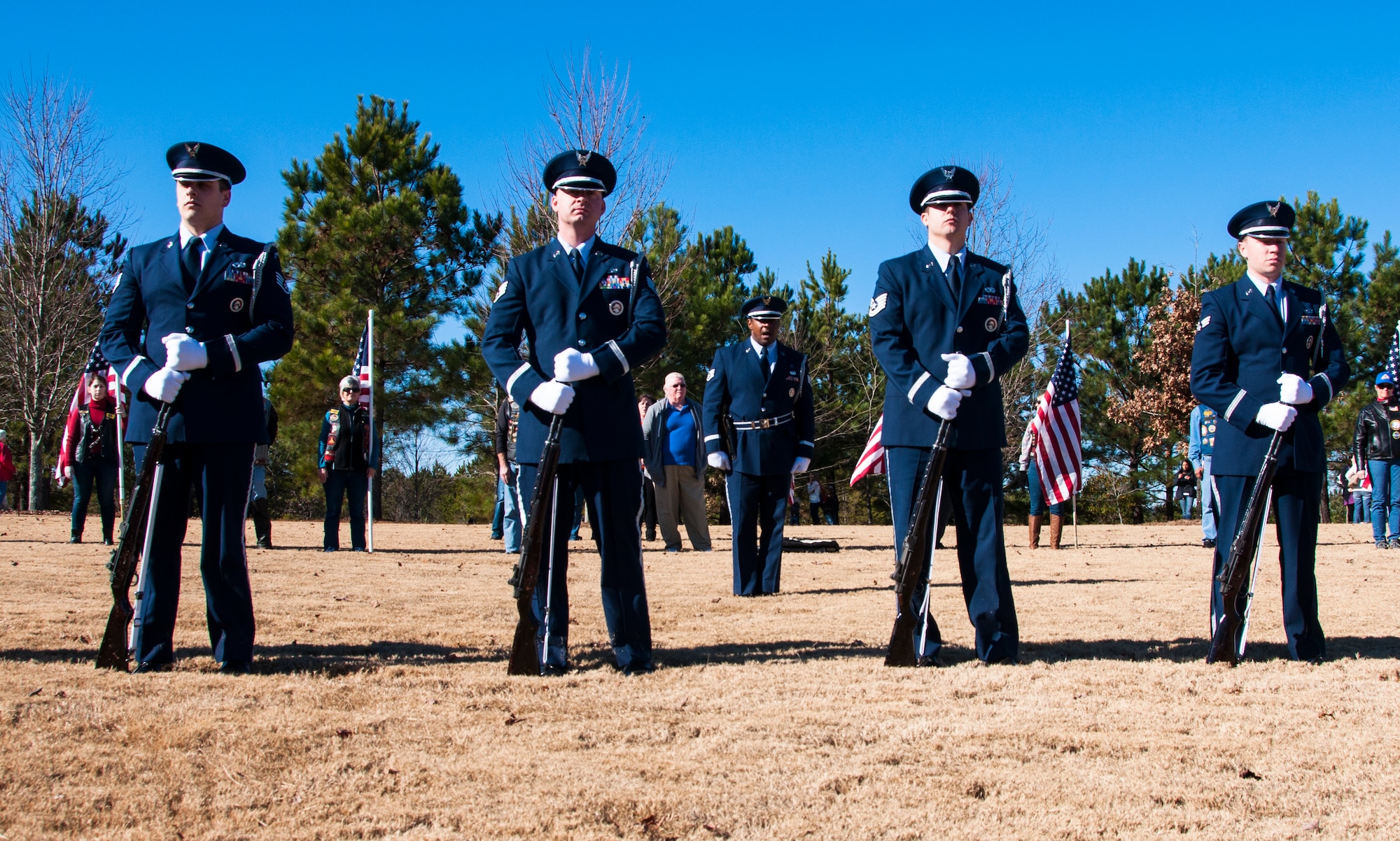 Honor Guard members from Dobbins Air Reserve Base, Ga. stand in formation for Wreaths Across America ceremony at Georgia National Cemetery in Canton, Ga. Dec. 13, 2014. The vision of the U.S. Air Force Honor Guard is to ensure a legacy of Airmen who promote the mission, protect the standards, perfect the image and preserve the heritage of the organization. (U.S. Air Force photo/Senior Airman Daniel Phelps)