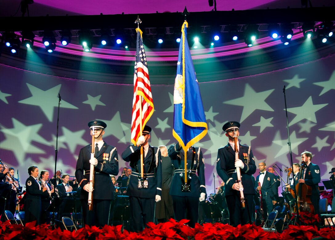 The United States Air Force Honor Guard posts the colors at “The Spirit of the Season” holiday concert performed by the United States Air Force Band at the Daughters of the American Revolution concert hall in Washington, D.C., Dec, 12, 2014. (U.S. Air Force photo/ Senior Airman Mariah Haddenham)