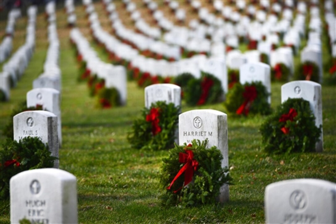 Holiday wreaths adorn the graves of fallen service members across Arlington National Cemetery in Arlington, Va., Dec. 13, 2014. Volunteers placed about 700,000 remembrance wreaths on National Wreaths Across America Day.