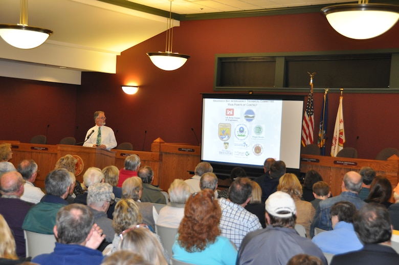 Project Manager, Craig Forgette talks with a full house at the Town of Greece, Town Hall for the Braddock Bay Ecosystems Restoration Project public meeting.