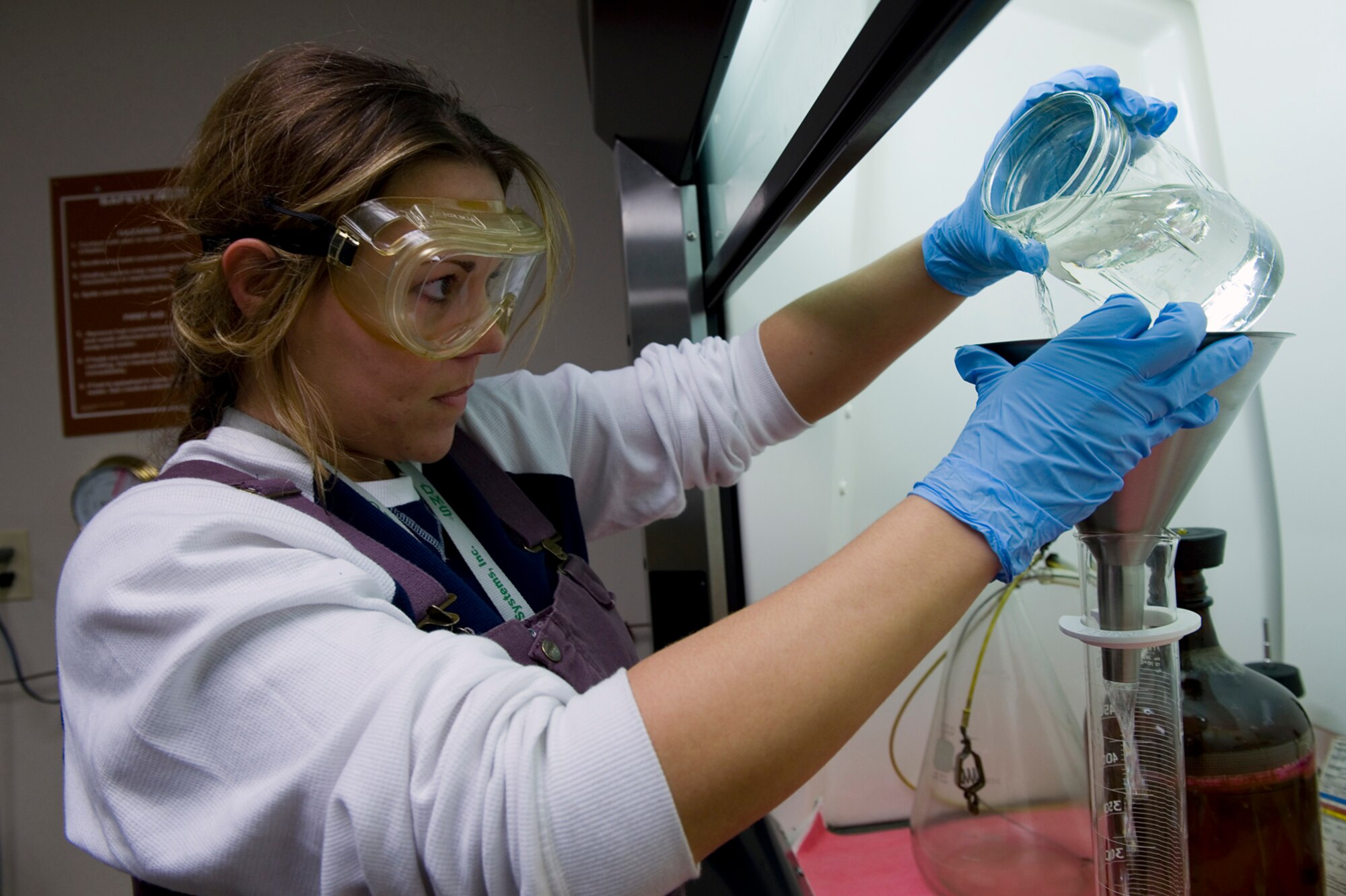 Christina Looney, 434th Air Refueling contracted fuels laboratory technician, conducts a fuels system icing inhibitor test on Jet-A jet fuel at Grissom Air Reserve Base, Ind., Nov. 14, 2014. Grissom’s recently transitioned from JP-8 jet fuel to Jet-A, a commercial grade jet fuel, as part of an Air Force cost savings initiative. (U.S. Air Force photo/Staff Sgt. Benjamin Mota)