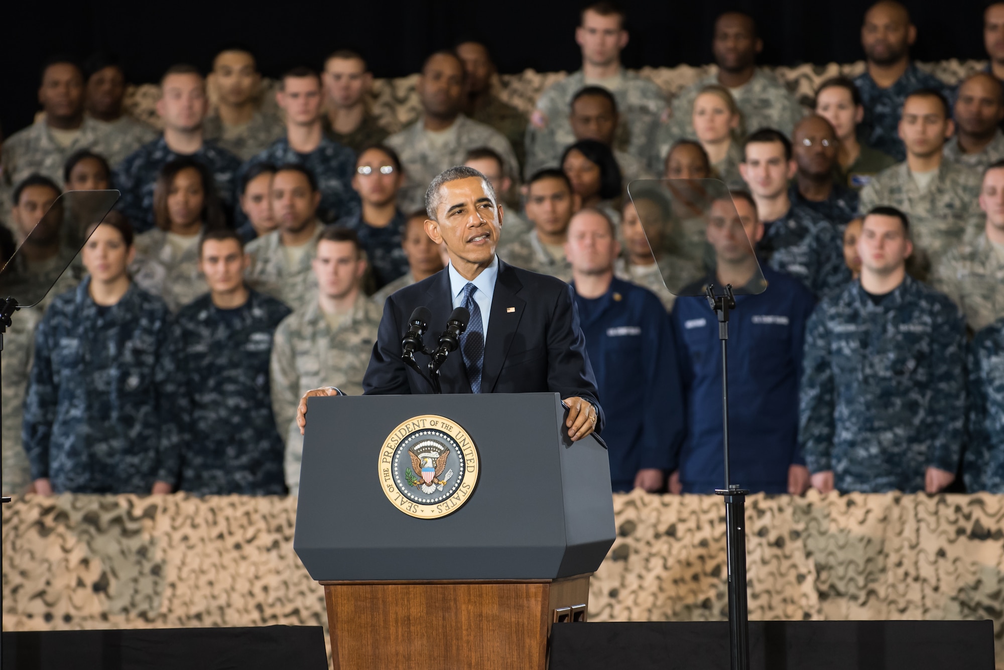 President Barack Obama addresses a crowd of service members and Defense Department civilians Dec. 15, 2014, at Joint Base McGuire-Dix-Lakehurst, N.J. The event allowed more than 3,000 military and civilian personnel to listen to their commander in chief discuss current conflicts and mission readiness, but more importantly thank the attendees for their service and dedication to their nation. (U.S. Air Force photo/Russ Meseroll)