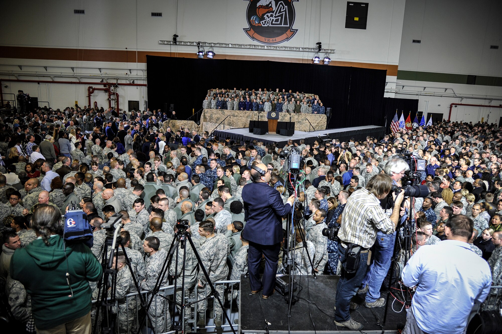 President Barack Obama addresses a crowd of service members and Defense Department civilians Dec. 15, 2014, at Joint Base McGuire-Dix-Lakehurst, N.J. The event allowed more than 3,000 military and civilian personnel to listen to their commander in chief discuss current conflicts and mission readiness, but more importantly thank the attendees for their service and dedication to their nation. (U.S. Air Force photo/Staff Sgt. Scott Saldukas)