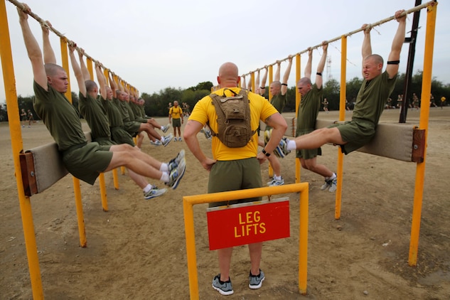 Recruits of Echo Company, 2nd Recruit Training Battalion, perform leg lifts during the Circuit Course at Marine Corps Recruit Depot San Diego, Dec. 11. The Circuit Course begins with a half-mile run and includes 14 different exercises. 