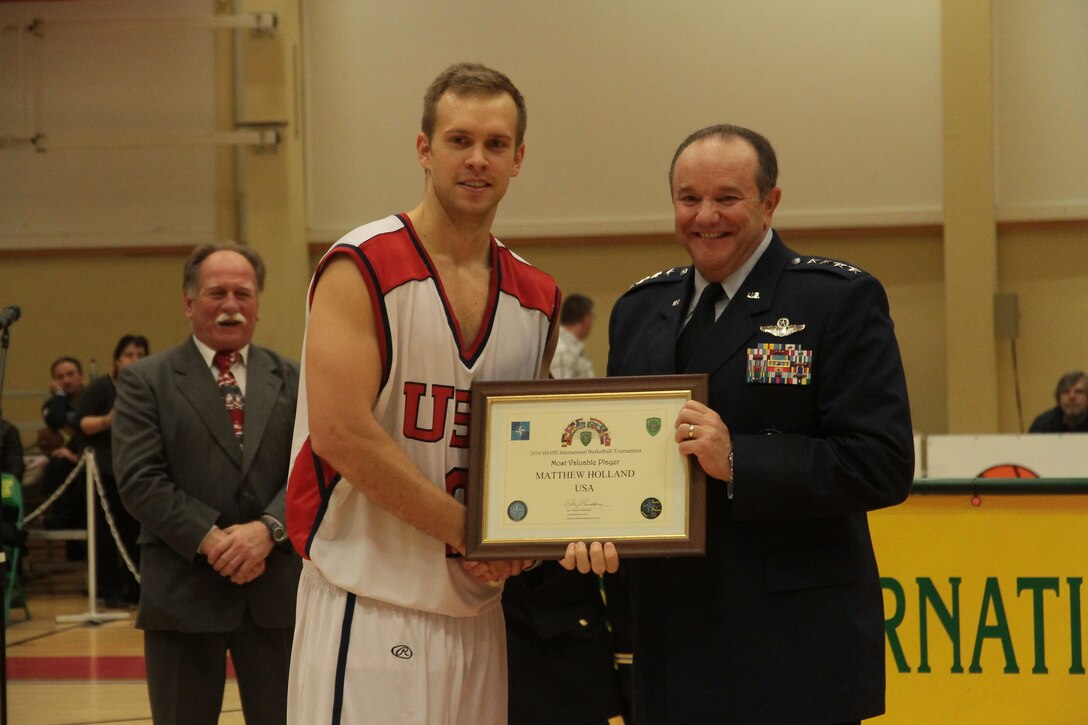 Air Force Capt. Matt Holland of Hanscom Air Force Base, Mass., here with Supreme Allied Commander Gen. Philip Breedlove, was named the tournament MVP. The U.S. Armed Forces men defeated Lithuania 89-82 to win the SHAPE International Basketball Championship for the first time since 2010. Photo courtesy of Patrick Ferriol, pfphotography.be