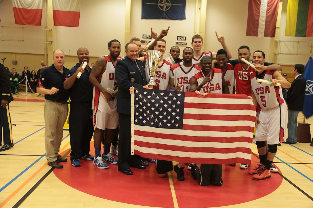 U.S. Armed Forces Men's Basketball team with Supreme Allied Commander-Europe, Gen. Philip Breedlove after capturing the SHAPE International Basketball Championship by defeating Lithuania 89-82.  Photo courtesy of Patrick Ferriol, pfphotography.be