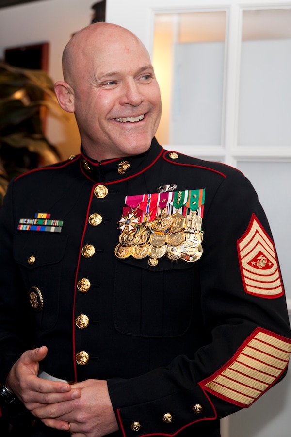 17th Sgt. Maj. of the Marine Corps, Sgt. Maj. Micheal P. Barrett talks with Marines during the reception of Mess Night hosted by the Camp Lejeune Staff Non Commissioned Officer Academy Career Course Class 1-15, aboard Marine Corps Air Station New River, N.C., Dec 4, 2014. Sgt. Maj. Barrett was the guest of honor for the ceremony. (U.S. Marine Corps photo by Cpl. Michael C. Guinto / Released)