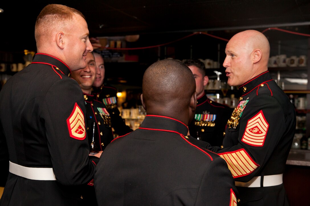17th Sgt. Maj. of the Marine Corps, Sgt. Maj. Micheal P. Barrett talks with Marines during the reception of Mess Night hosted by the Camp Lejeune Staff Non Commissioned Officer Academy Career Course Class 1-15, aboard Marine Corps Air Station New River, N.C., Dec 4, 2014. Sgt. Maj. Barrett was the guest of honor for the ceremony. (U.S. Marine Corps photo by Cpl. Michael C. Guinto / Released)