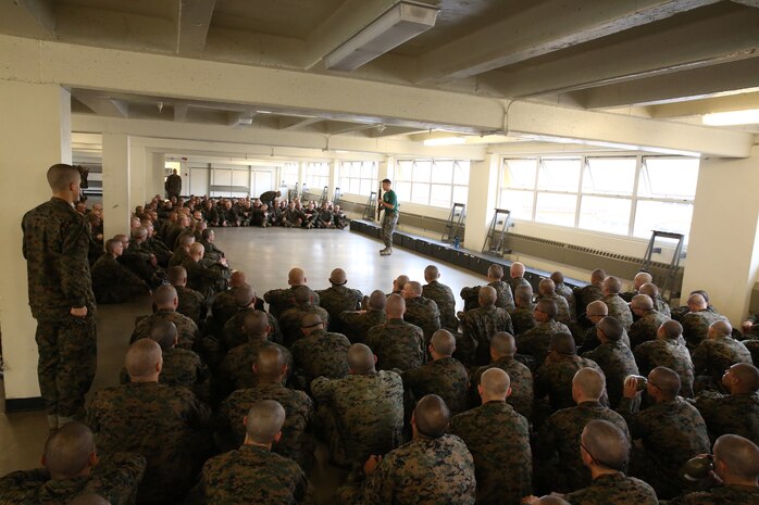 Recruits of Bravo Company, 1st Recruit Training Battalion, watch a demonstration of how to employ bayonets during a Marine Corps Martial Arts Program class at Marine Corps Recruit Depot San Diego Calif., Dec. 9. If a recruit was unsure of a particular technique, he stood up to attention and asked the MCMAP instructor for an additional demonstration.