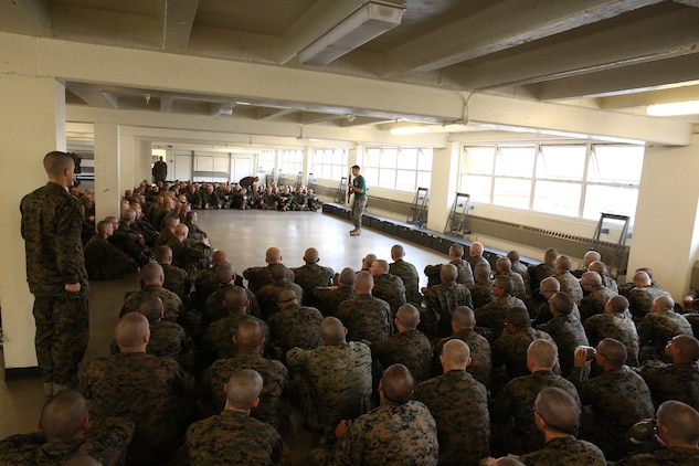 Recruits of Bravo Company, 1st Recruit Training Battalion, watch a demonstration of how to employ bayonets during a Marine Corps Martial Arts Program class at Marine Corps Recruit Depot San Diego Calif., Dec. 9. If a recruit was unsure of a particular technique, he stood up to attention and asked the MCMAP instructor for an additional demonstration.