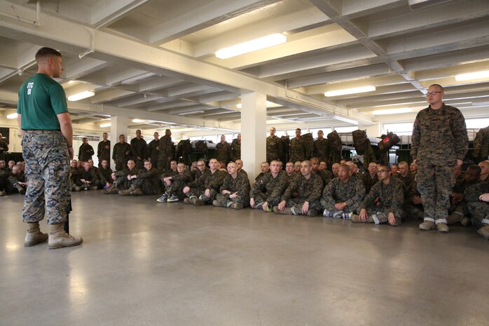 A recruit of Bravo Company, 1st Recruit Training Battalion, stands at attention and asks a question about the bayonet techniques during a Marine Corps Martial Arts Program class at Marine Corps Recruit Depot San Diego Calif., Dec. 9. Part of this training focused on how to fix bayonets to the M16-A4 Service Rifle and utilize it in close quarters combat.  