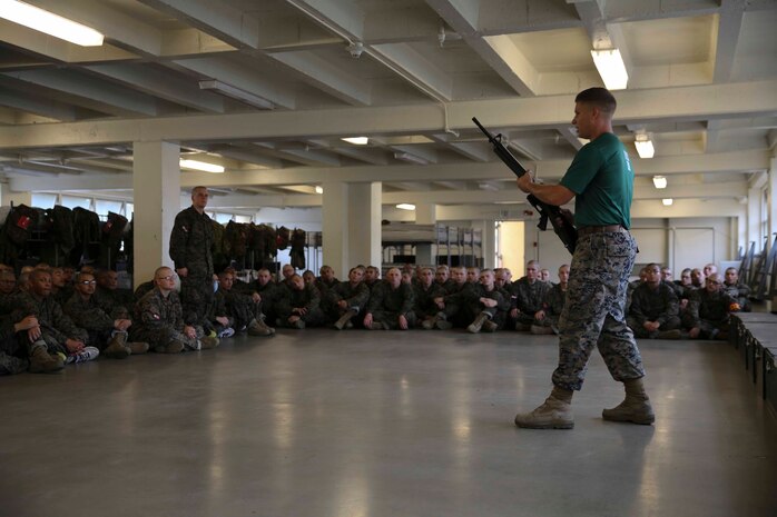 Recruits of Bravo Company, 1st Recruit Training Battalion, learn how to employ their bayonets during a Marine Corps Martial Arts Program class at Marine Corps Recruit Depot San Diego Calif., Dec. 9. The MCMAP instructor ensured the recruits knew how to conduct each individual skill before moving on to the next one and that they understood the proper form and how to implement the move.