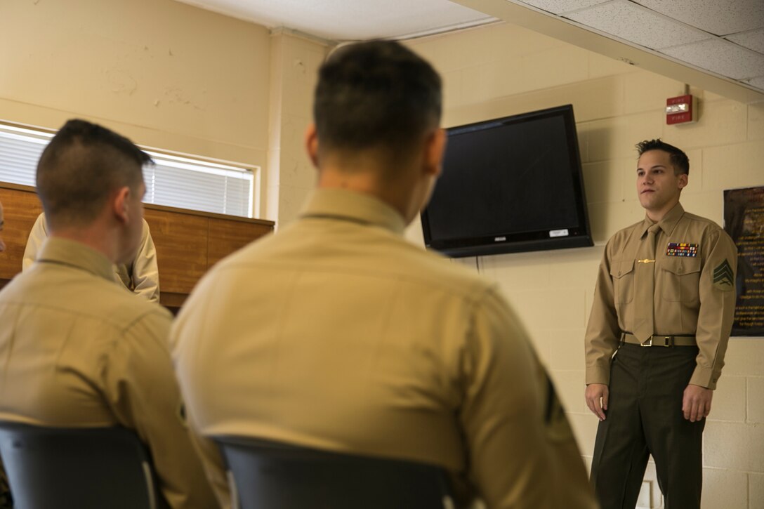 Sergeant Eamon Turnbull (right), a machine gunner with Wounded Warrior Battalion East, speaks to the graduates of Combat Logistics Battalion 2’s Lance Corporal Leadership and Professional Ethics Seminar aboard Marine Corps Base Camp Lejeune, N.C., Dec. 12, 2014. The completion of the seminar ensures that future leaders have a firm understanding of the roles and responsibilities that the Marines will assume with higher rank.