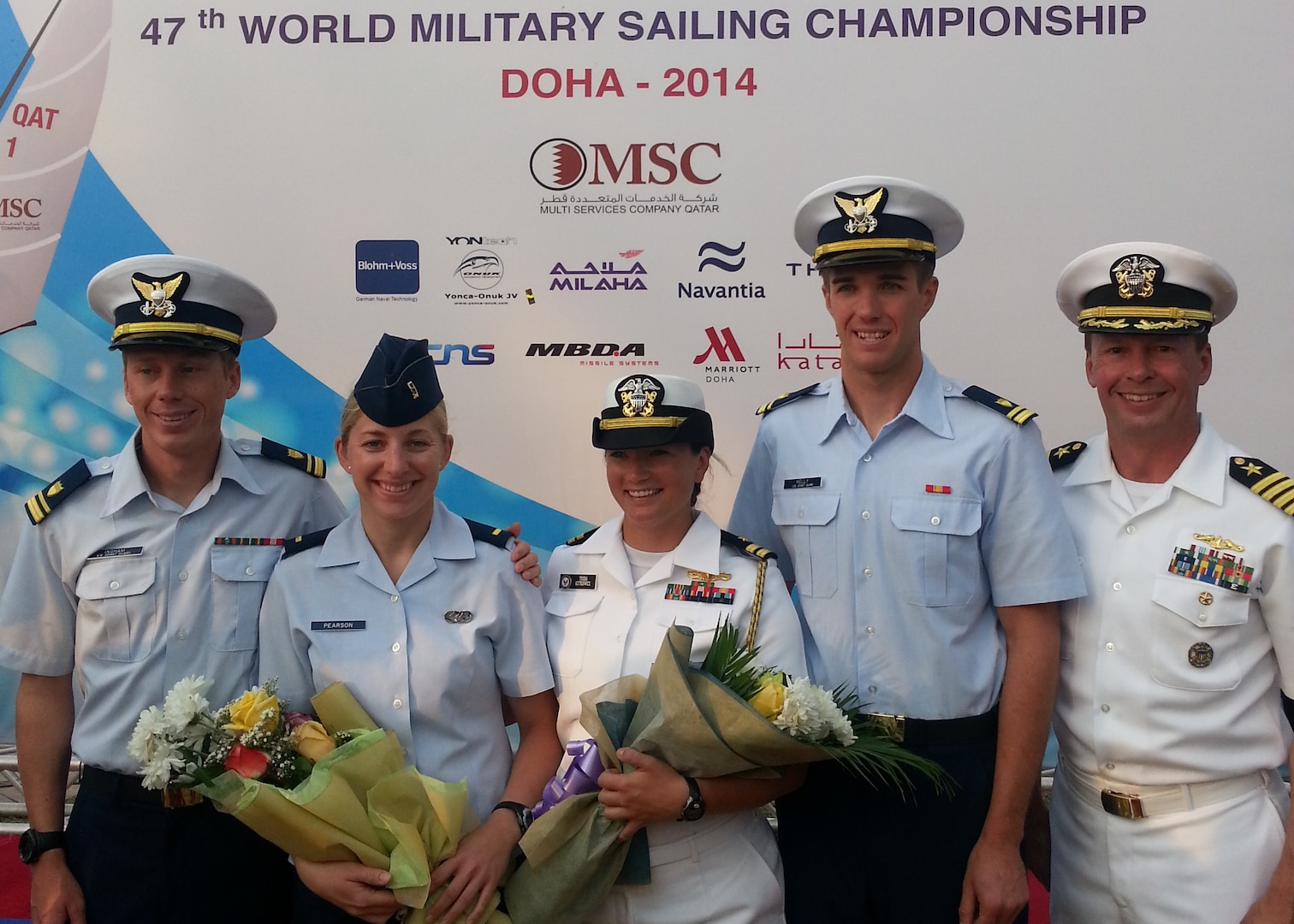 Team USA from left to right: Men’s skipper Coast Guard Lt. j.g. Samuel Ingham of Naval Air Station Pensacola, Fla., Air Force 2nd lt. Keisha Pearson of Joint Base Langley-Eustis, Va., Women’s skipper Navy Lt. Trisha Kutkiewicz of Washington, D.C., Coast Guard Lt. j.g. Sean Kelly of San Francisco Sector, Calif. and Chief of Mission Navy Capt. Eric Irwin of Newport, R.I. The 47th CISM World Military Sailing Championship was held in Doha, Qatar Nov. 22-29, 2015.