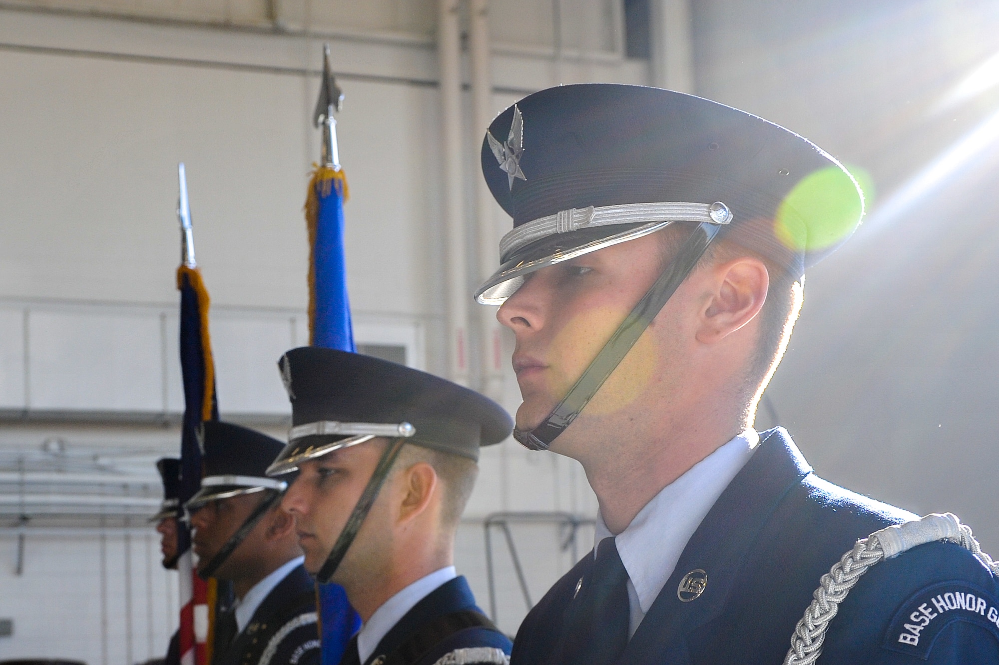 Hurlburt Field Honor Guard members stand ready to post the colors during an Air Force Cross ceremony at the Freedom Hangar on Hurlburt Field, Fla., Dec. 17, 2014. Master Sgt. Ivan Ruiz, a pararescueman from the 56th Rescue Squadron, Royal Air Force Lakenheath, England, is the sixth U.S. military member to be awarded the Air Force Cross since 9/11. All six Airmen who received this medal, including Ruiz, have all been Special Tactics Airmen. (U.S. Air Force photo/Airman 1st Class Jeff Parkinson)
